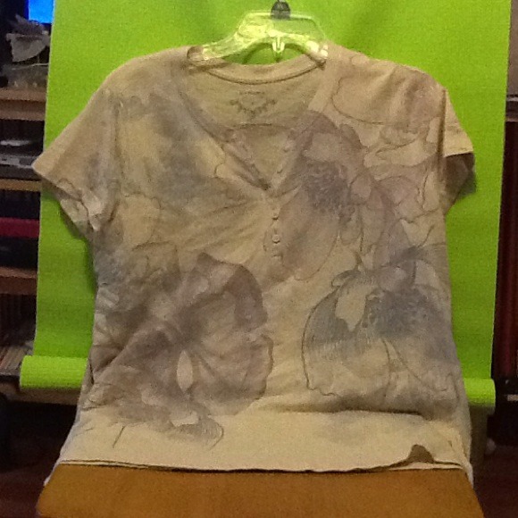 Cute tan and purple floral shirt.
