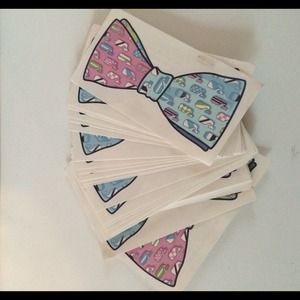 100 VV bow-tie tattoos