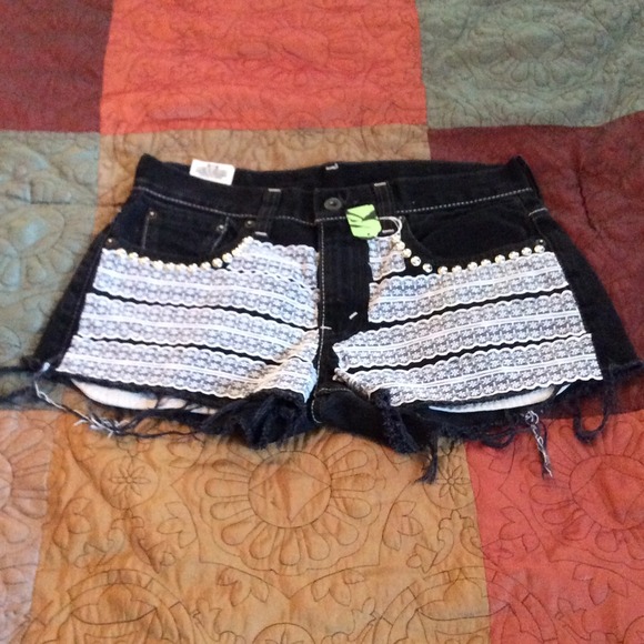 Levi's shorts. Lace design w studs.