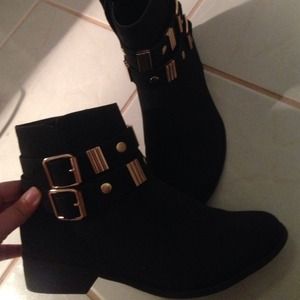 Black booties with gol accents