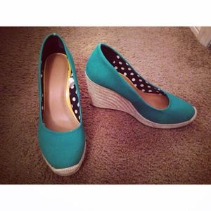 Teal wedge heels.