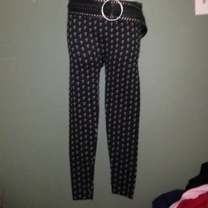 Leggings with crosses on them. Includes belt.