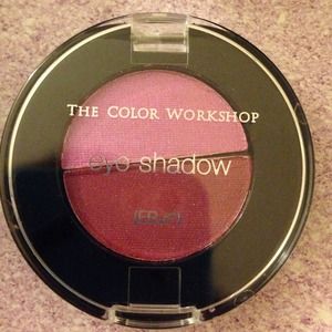 Four eyeshadows with a purple liquid eyeliner