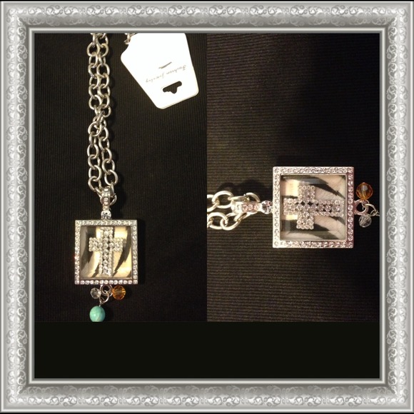 Necklace with a charm a cross bling in the middle