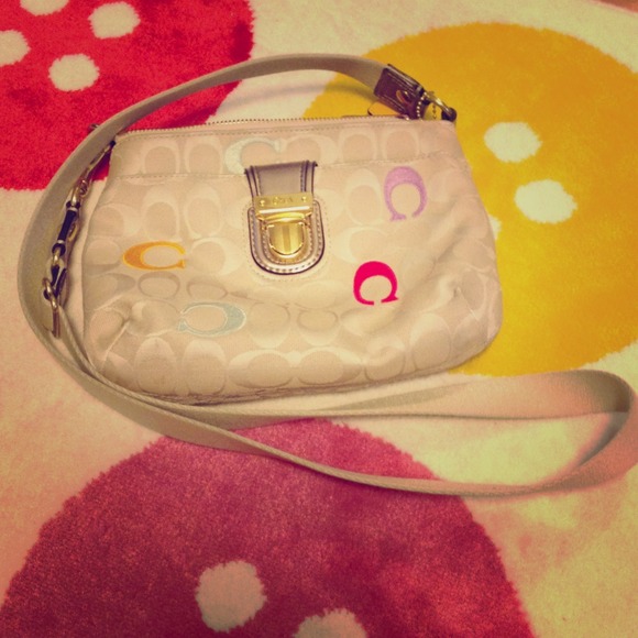 Small Coach crossbody bag with colorful details.