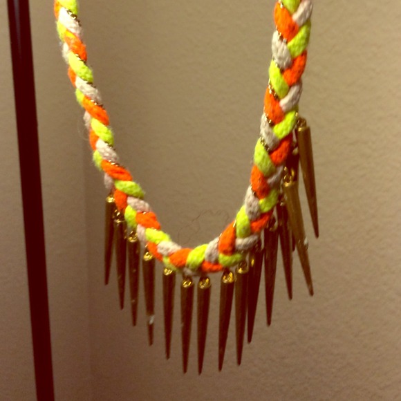 Stylish necklace with gold daggers.