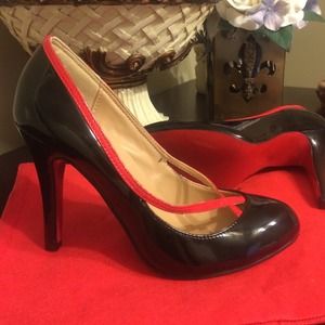 Black Heels with red soles.