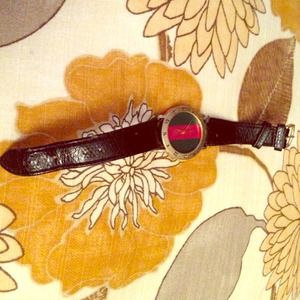 A Gucci watch ,genuine leather ,needs new leather.
