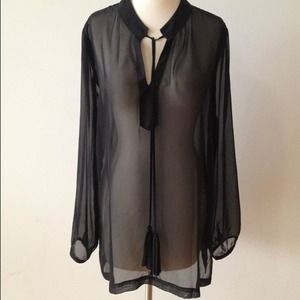 Black sheer blouse with tassels.