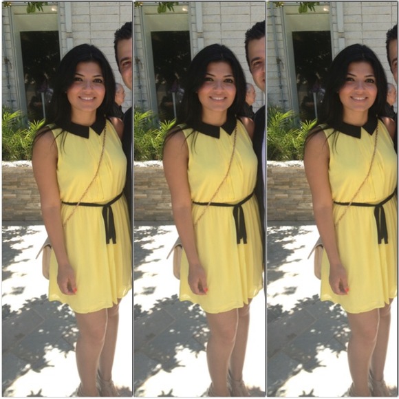 Cute little pastel yellow dress with black collar