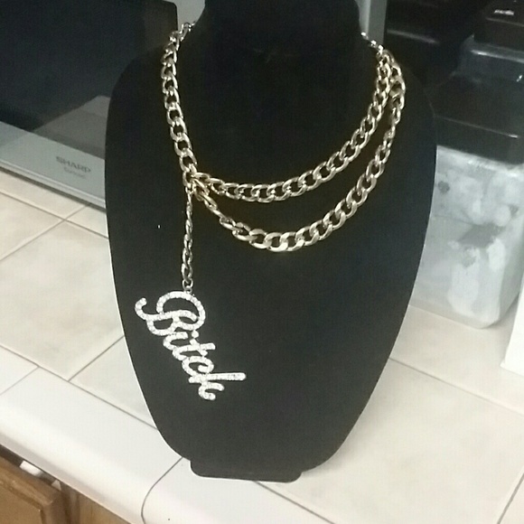 Gold "Bitch" statement piece