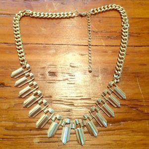 Gold spike necklace.
