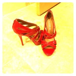 Strappy red high heels.