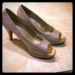 Silver peeptoe heels.