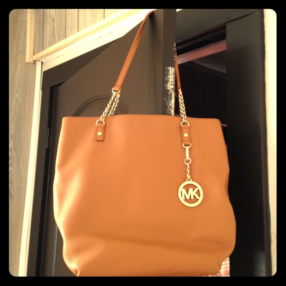 Authentic MK leather bag with Gold accents .