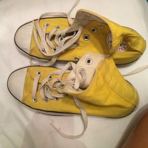Yellow converse high tops