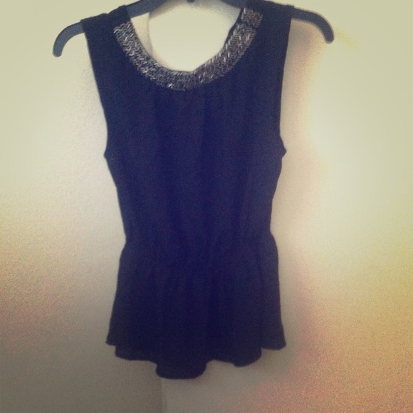 Black peplum shirt. Never worn. No tags.