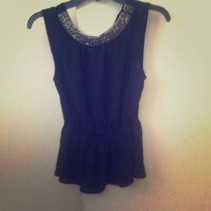 Black peplum shirt. Never worn. No tags.