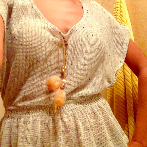 Grey top with feather accents