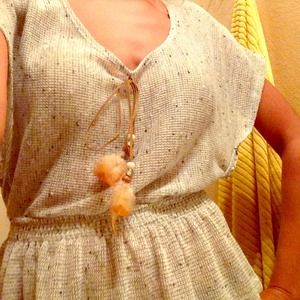 Grey top with feather accents