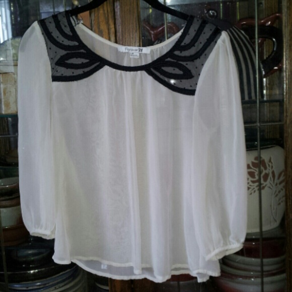 Cream colored see-through blouse
