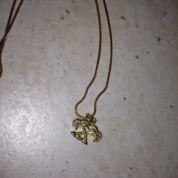 Gold color palm tree necklace