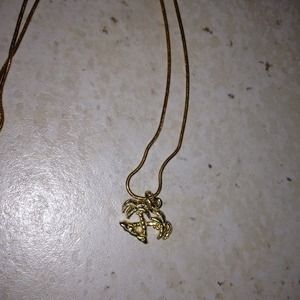 Gold color palm tree necklace