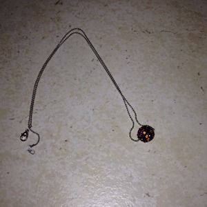 Necklace with black call with orange and purple