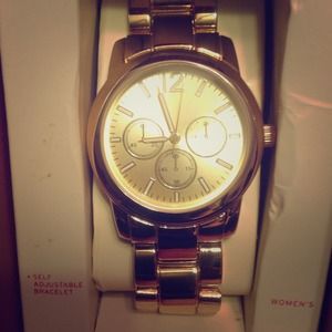Brand new in box woman's gold watch