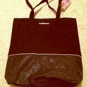 VS black tote w/ sparkly gold at the bottom.
