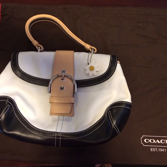 Coach white canvas and black leather handbag.