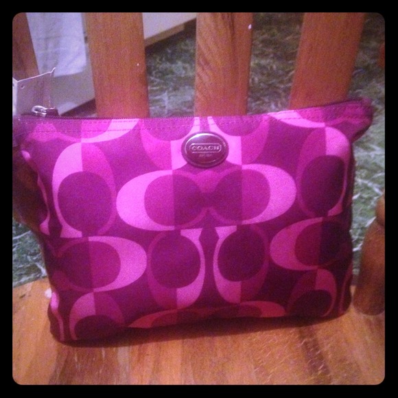 HERE IS AN AUTHENTIC COACH BERRY WEEKEND BAG~~~