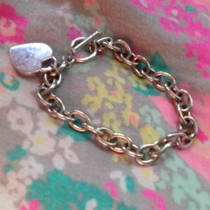 Silver chain heart bracelet.