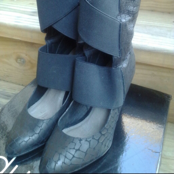 Black leather and suede wedge bootie