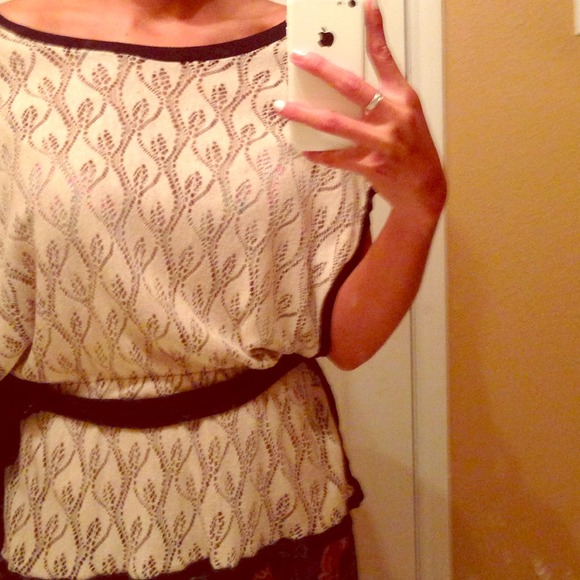 Sheer cream and black blouse