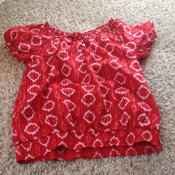 Top size Medium, vibrant red.