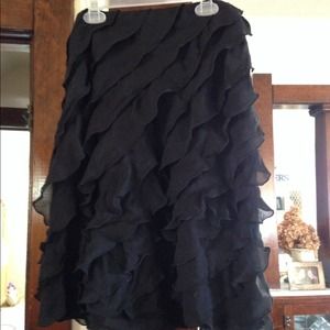 Short black ruffle skirt