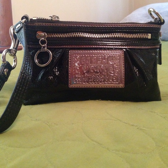 Black patent coach wristlet