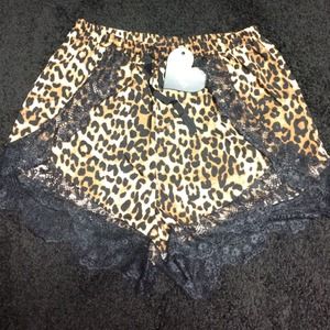Leopard print shorts with lace trim. NWT.