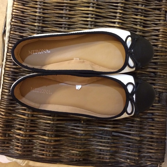 White ballet flats with black toe cap