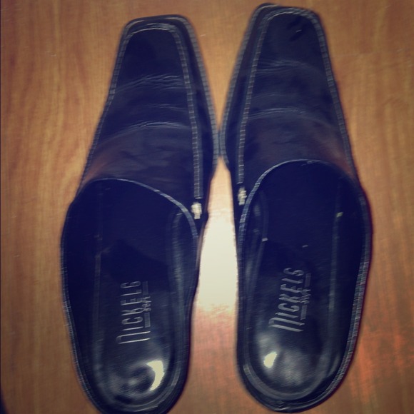 Previously owned black leather shoes