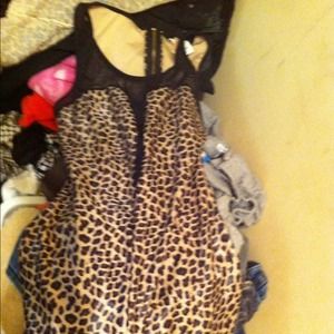 Hello I am selling a leopard print cat suite