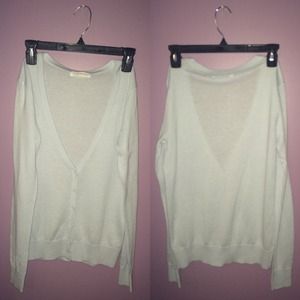 medium; light blue sweater