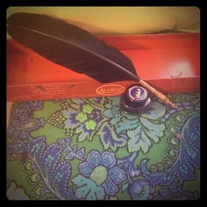 Black quill with case and violet ink