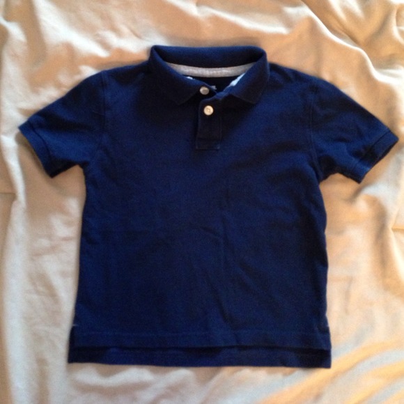 Navy blue child's short sleeved polo style shirt
