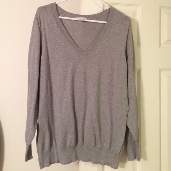 Grey V neck sweater.