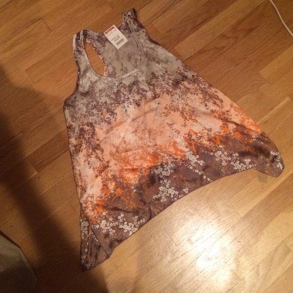 Multi color tank looks great with white pants