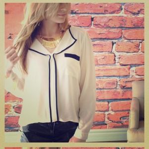 Cream blouse with black trim