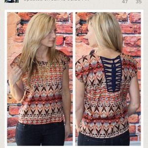 Tribal blouse with navy  detail on the back.