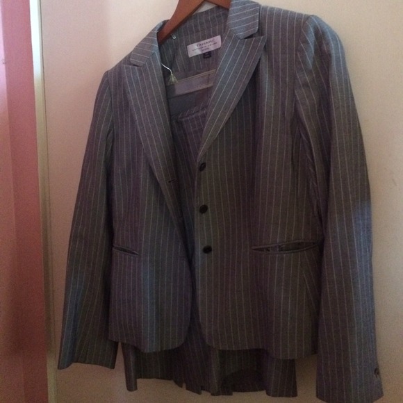 Grey fully lined pin striped suit.